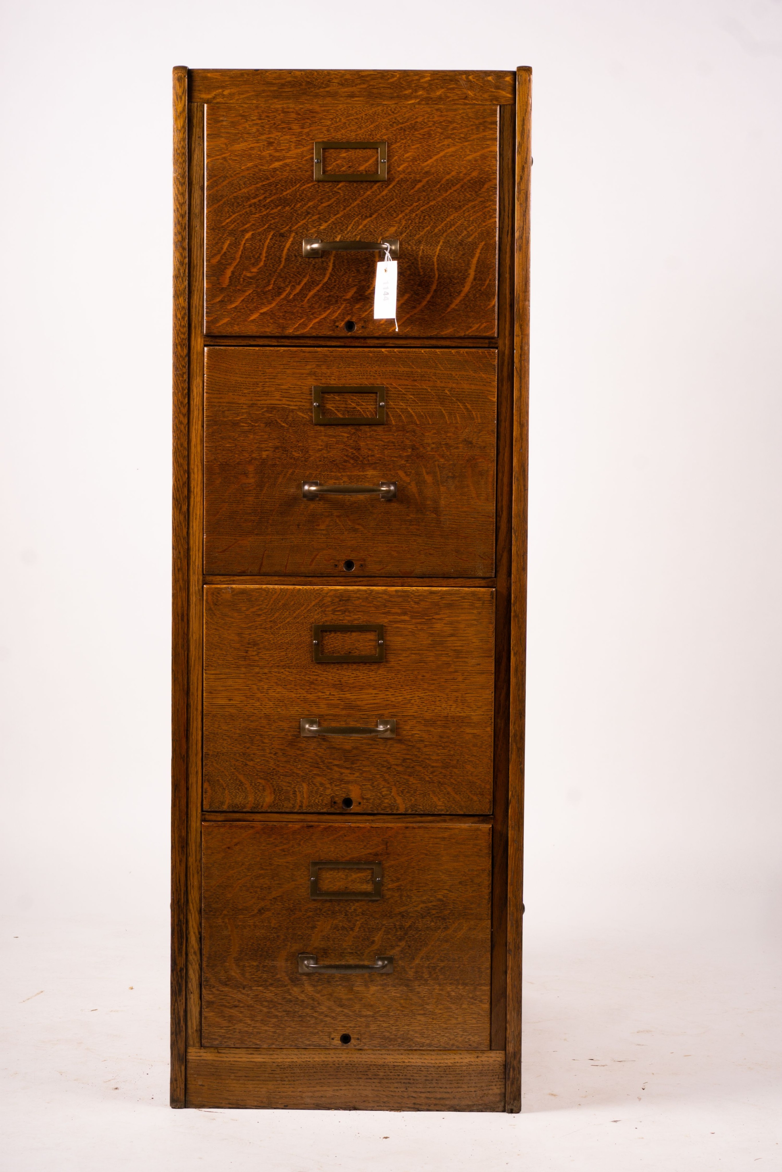 An early 20th century oak four drawer filing cabinet, W.44cm D.70cm. H.132cm